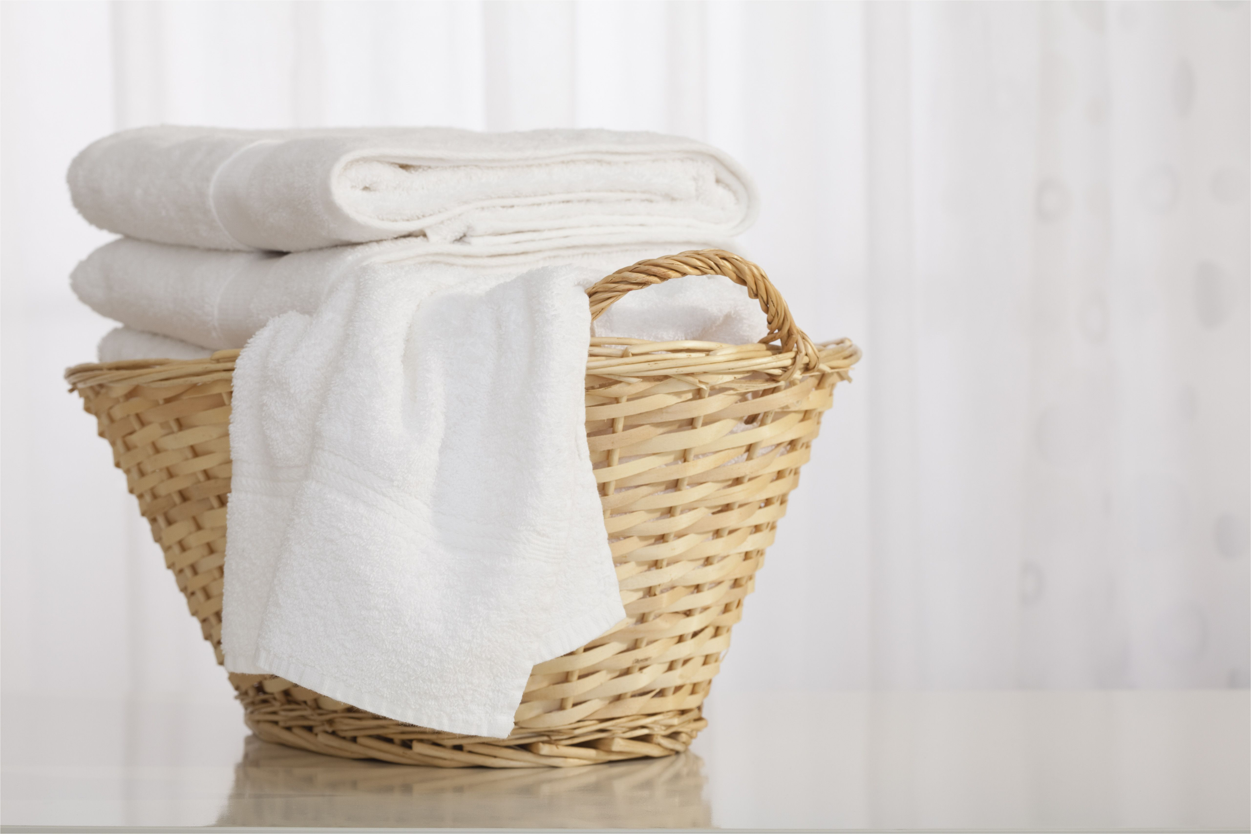 studio shot of stack of white towels in wicker basket 152892922 59d3f219054ad90010dc84c8 jpg