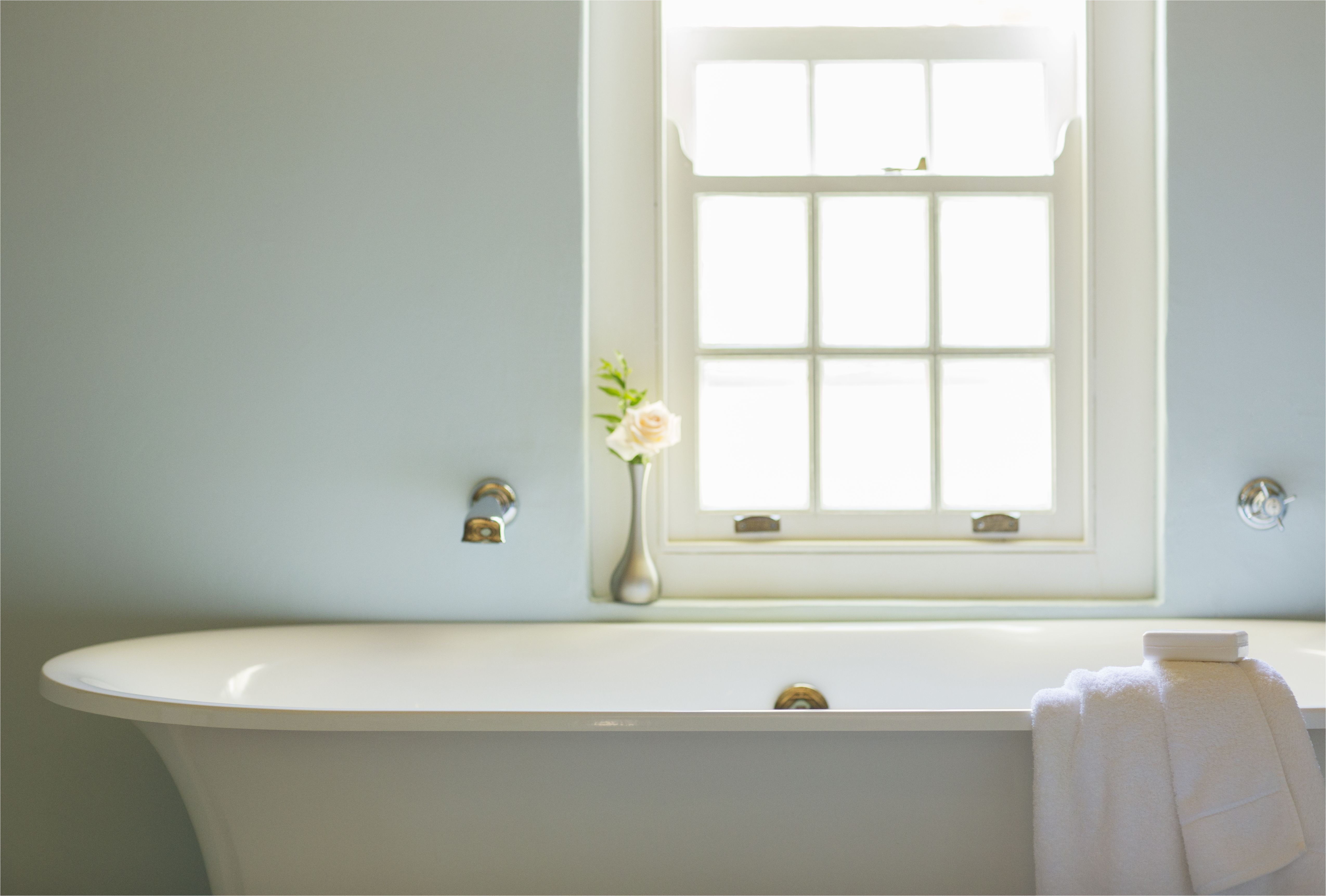 soaking tub below window in luxury bathroom 494358425 5aa1e931c064710037061882 jpg