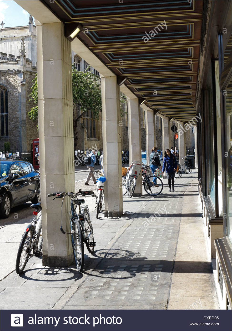 covered walkway in front of small shopping parade cambridge city stock image