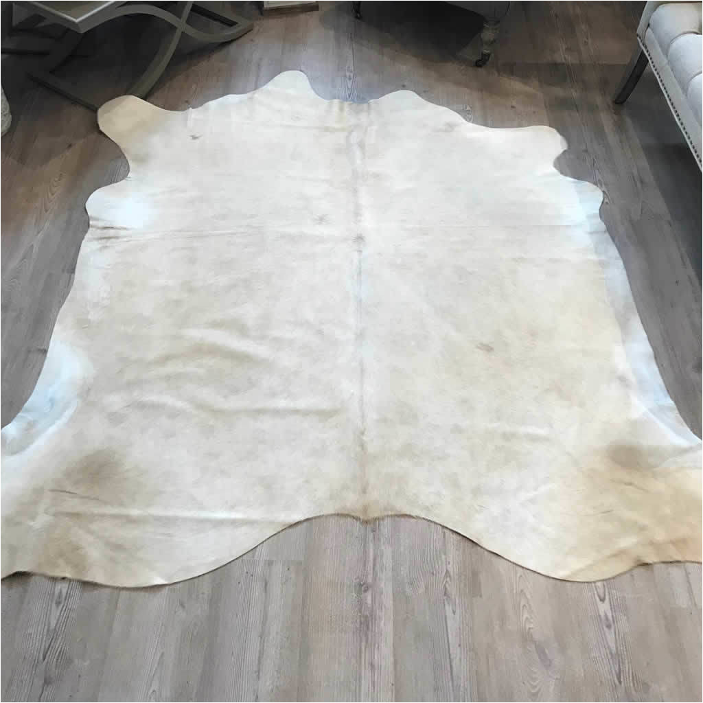 cowhide rug pale champagne golden tones