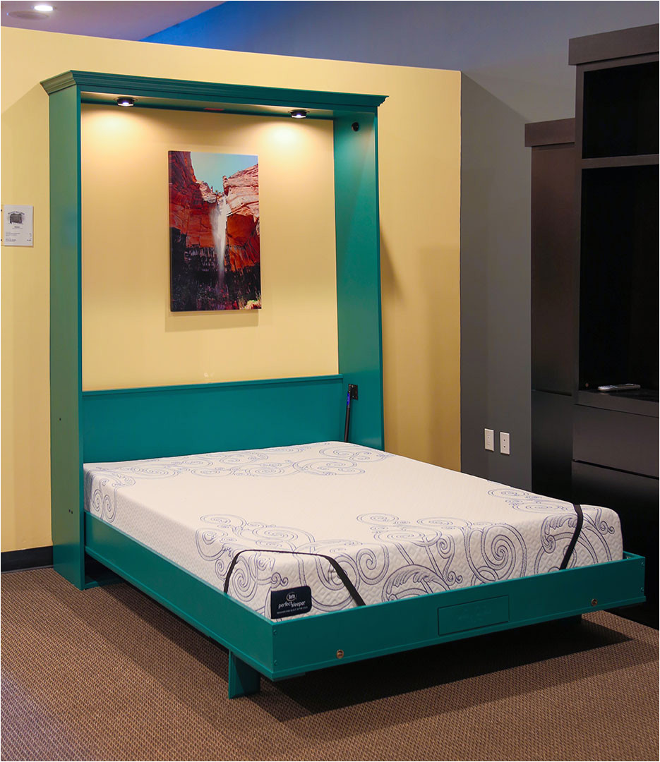 just touch the wireless remote and the power bed s premium foam mattress glides down from within the beautiful cabinet