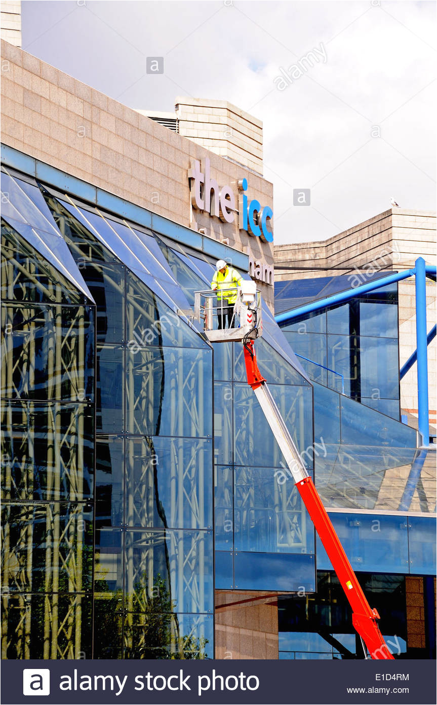 window cleaner cleaning the windows of the international convention centre and symphony hall birmingham