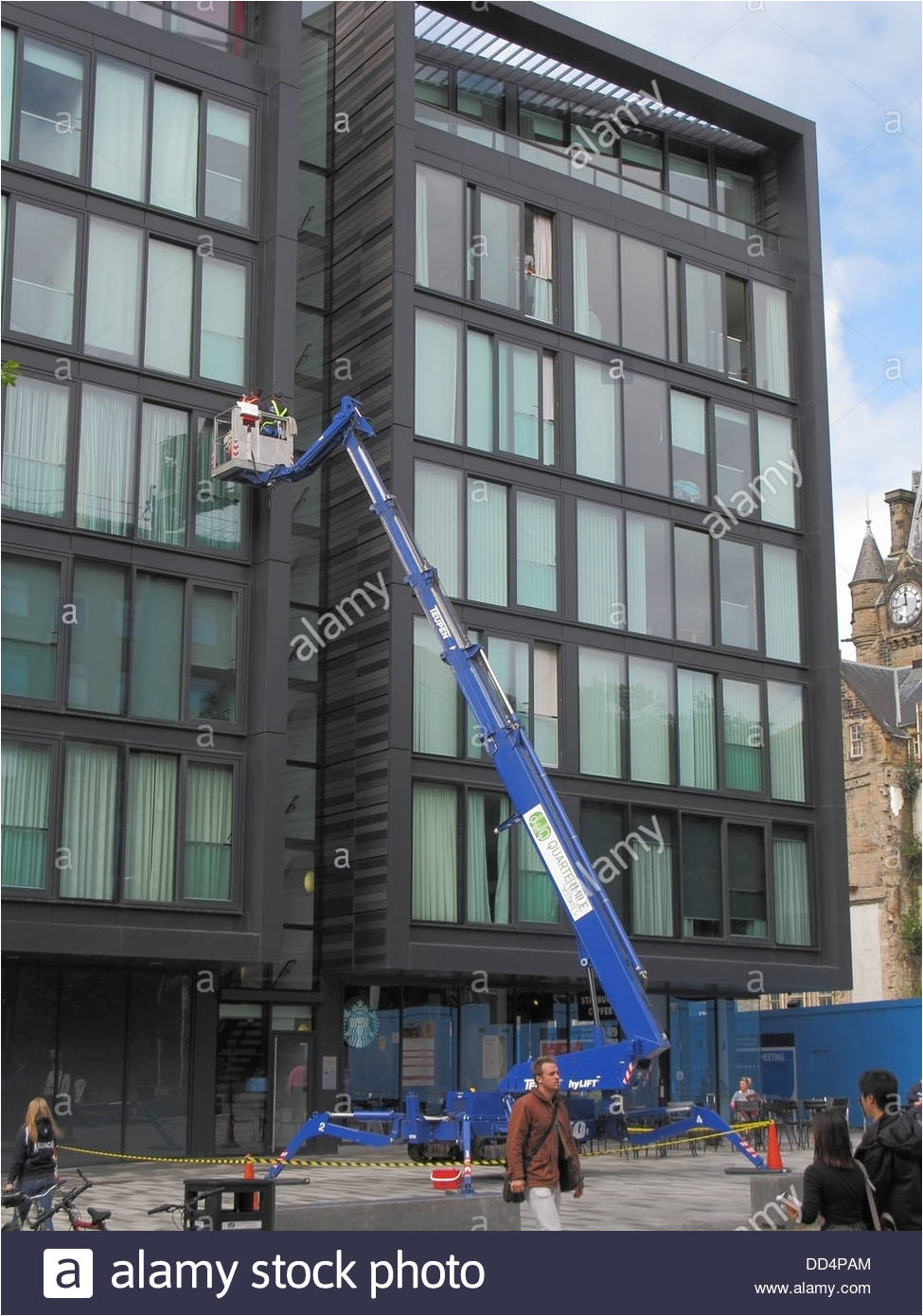 window cleaners using a hydraulic lift or cherry picker on the quartermile development middle meadow