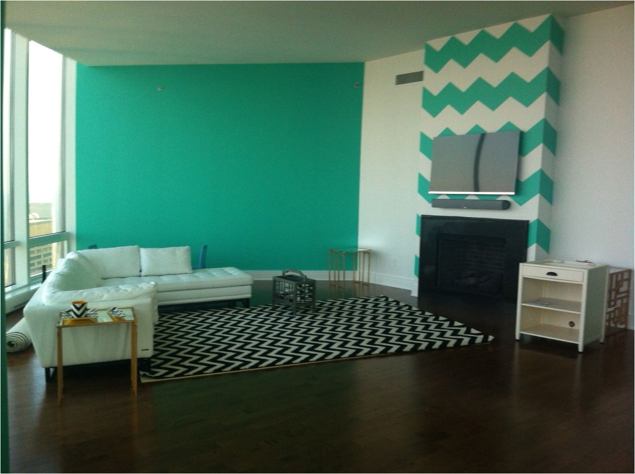 benjamin moore miami green is throughout my house i had the painter create chevron on the wall behind tv designed by chantel gia