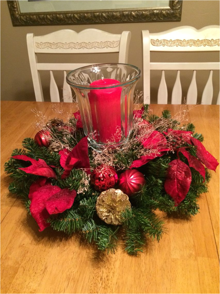 christmas centerpiece made with a wreath and a plate charger
