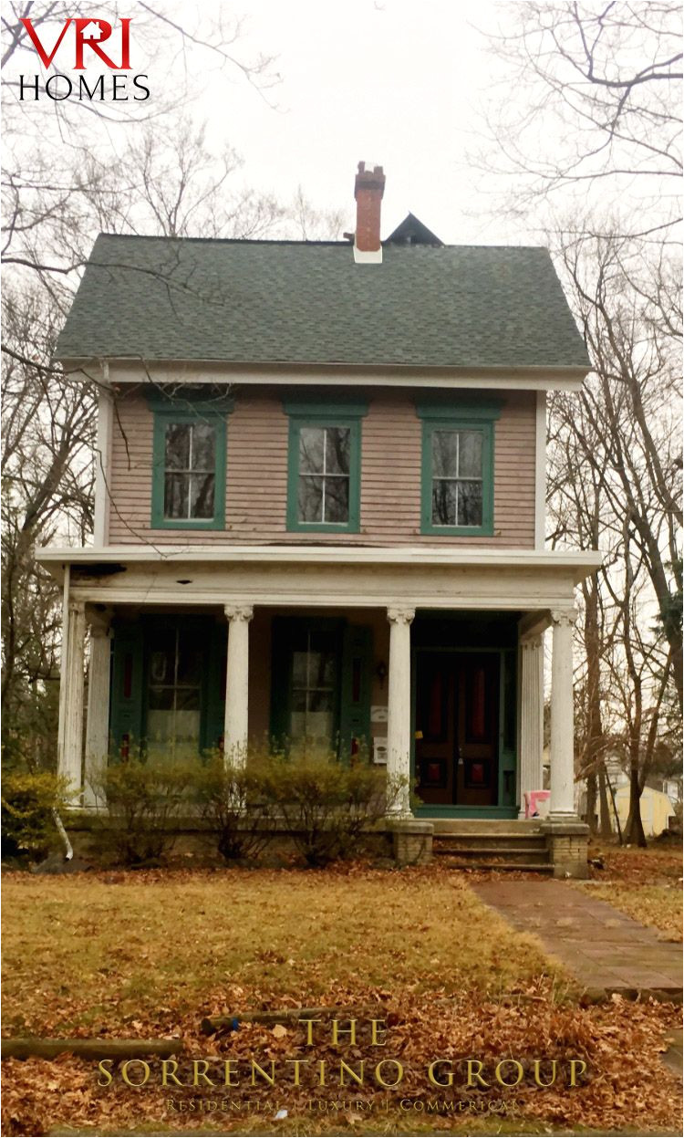 victorian home on pristine tree lined street