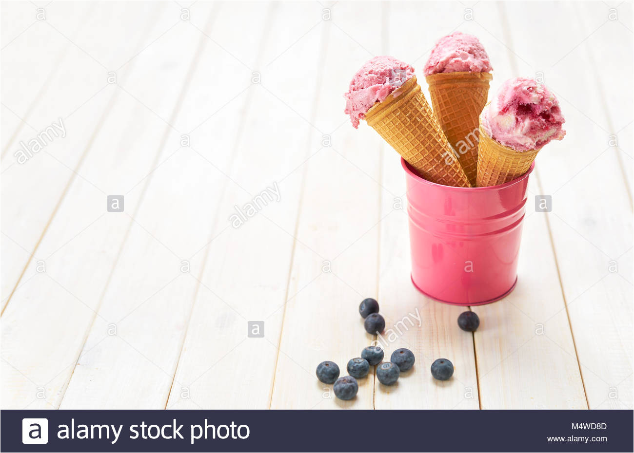 blueberry ice cream cones in mini bucket stock image