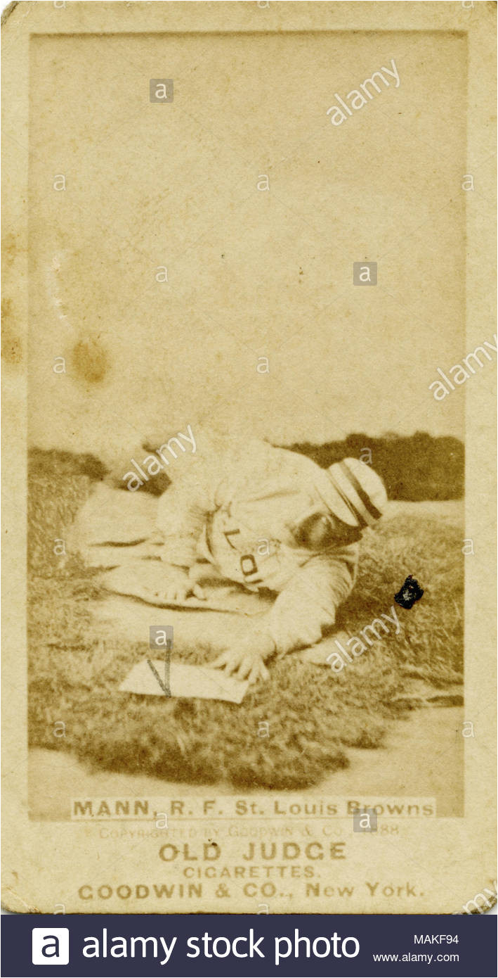 vertical sepia photograph on a baseball card of mann he is laying down as