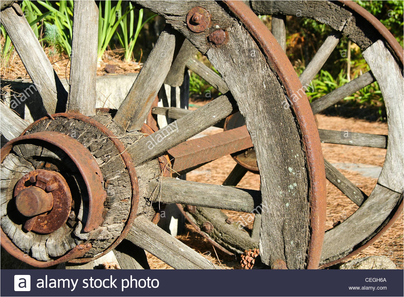 old wood and iron cart wheels stock image