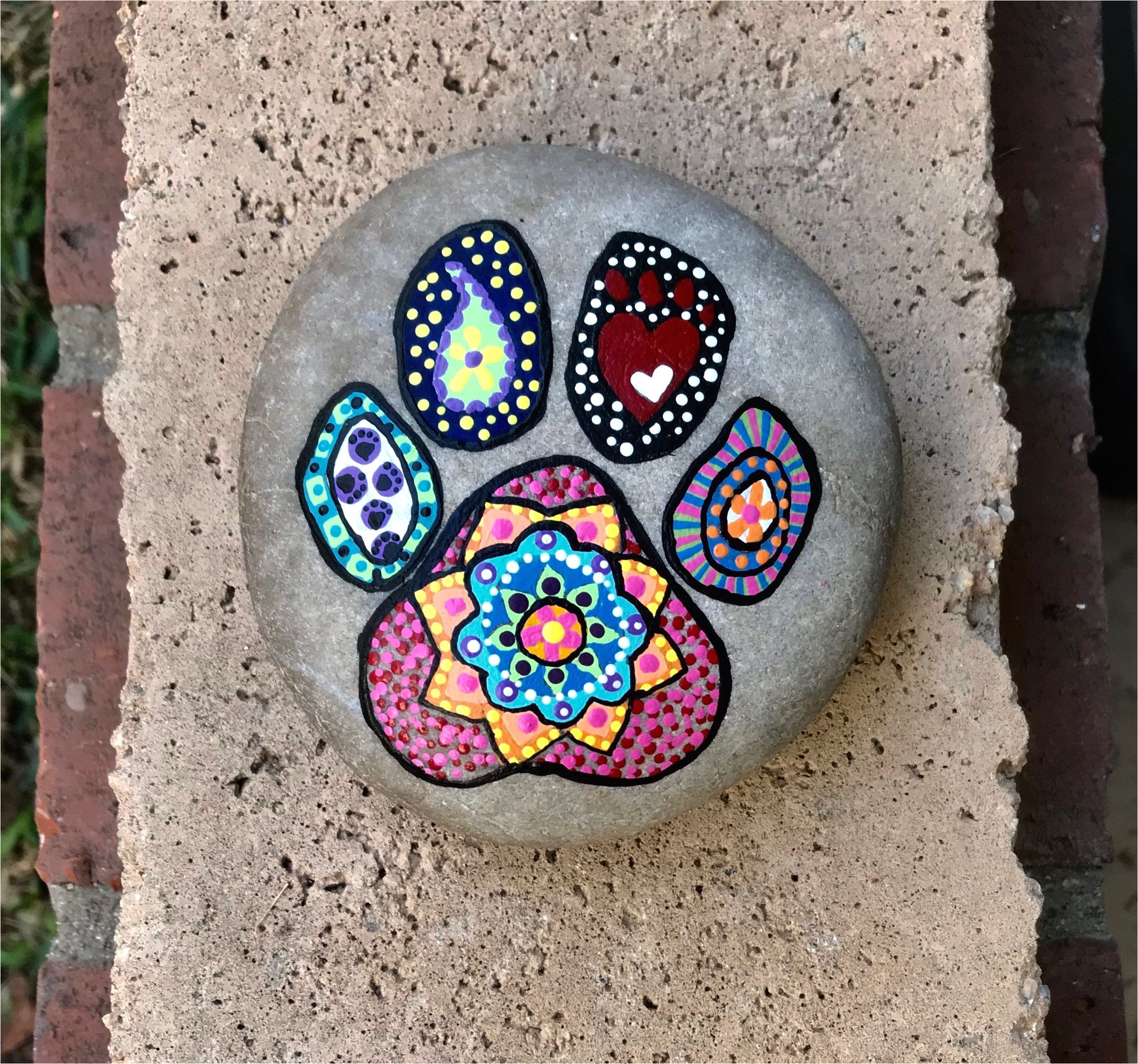 dog paw print hand painted mandala rock by justnaturalelements on etsy