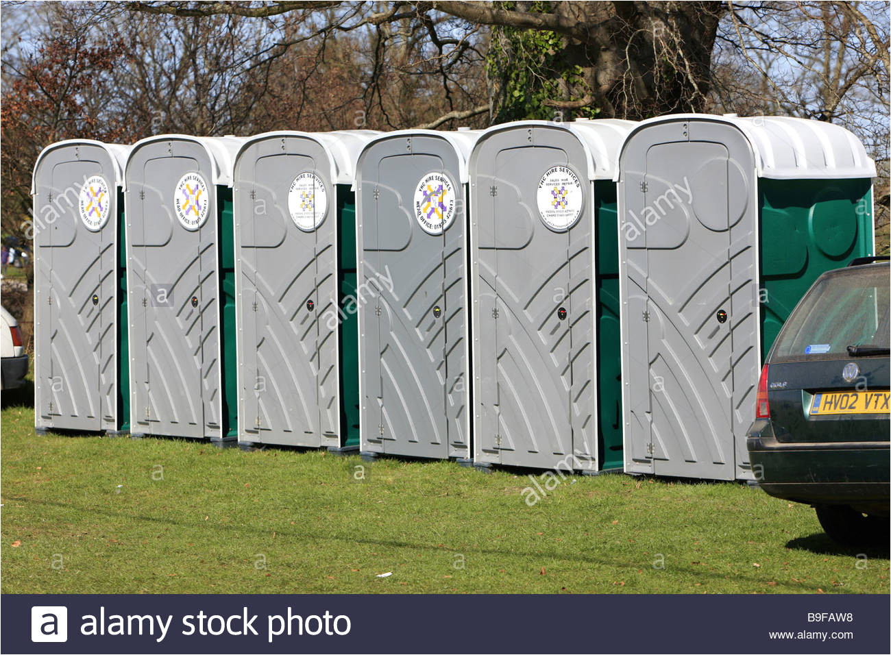 a row of portable loos or portapotty toilets at an outside event stock image