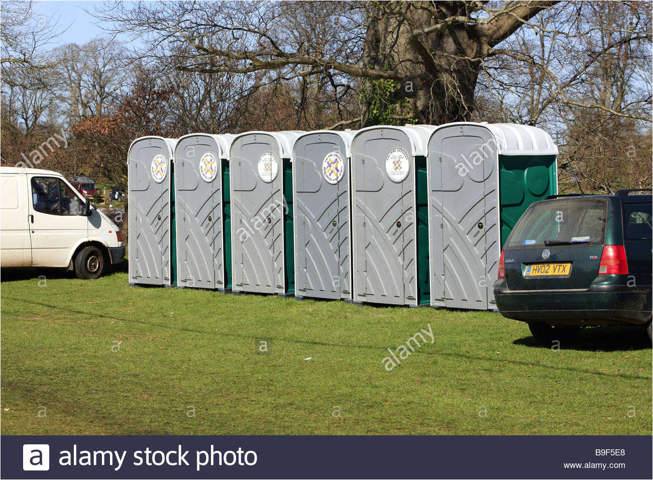 a row of portable loos or portapotty toilets at an outside event stock image