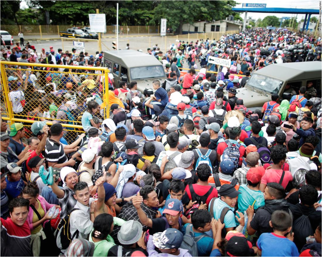 honduran migrants part of a caravan trying to reach the united states storm a