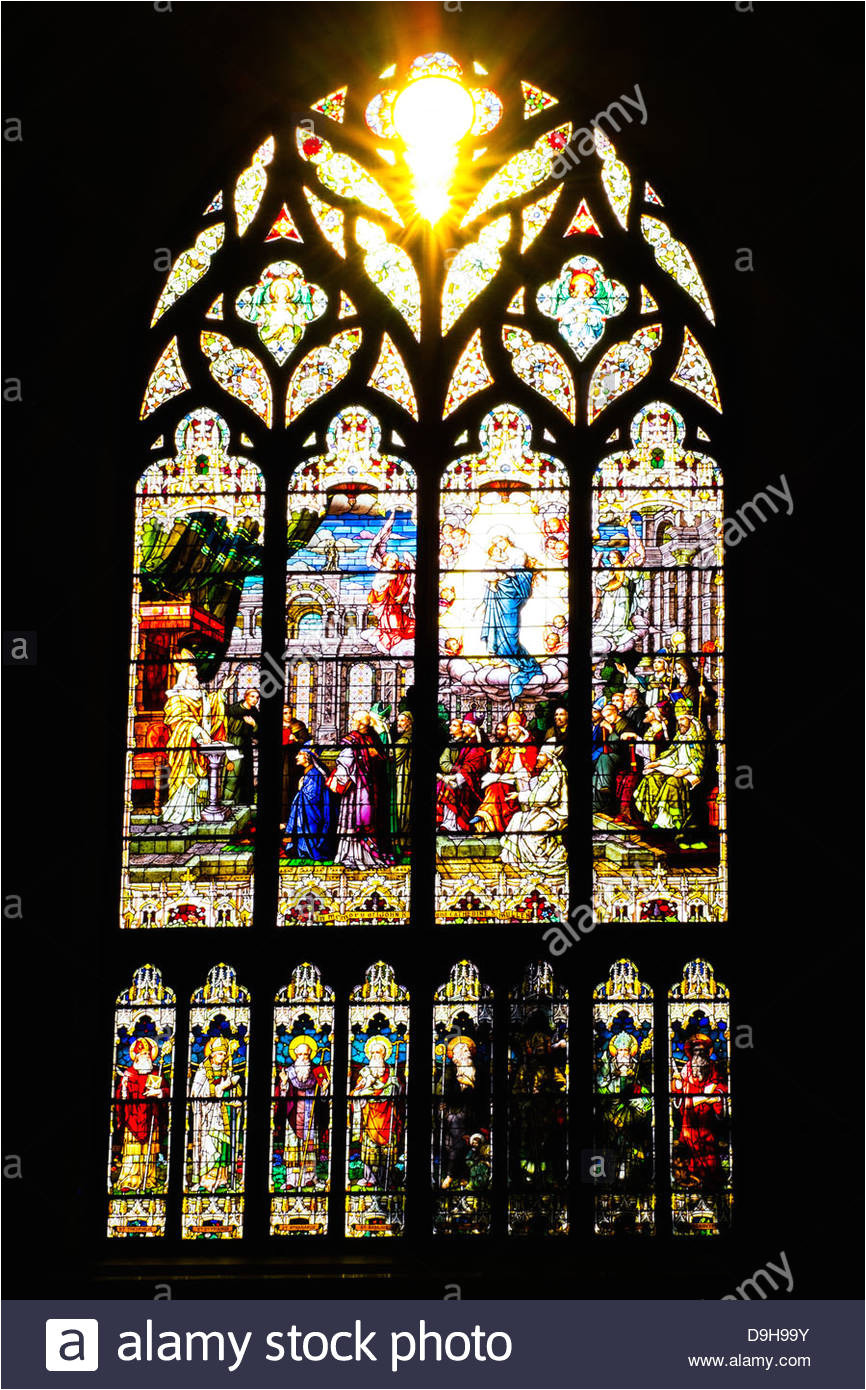 sun flare as seen through a stained glass window at the cathedral basilica of the immaculate