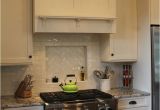 Alaska White Granite with Antique White Cabinets Almost Finished Light and Dark Kitchen with White Alaska