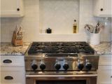 Alaska White Granite with Antique White Cabinets Granite White Alaska Delicatus Cabinets Brookhaven In