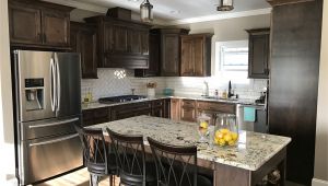 Alaska White Granite with Brown Cabinets Dark Walnut Stained Cabinets Alaska White Granite White Subway