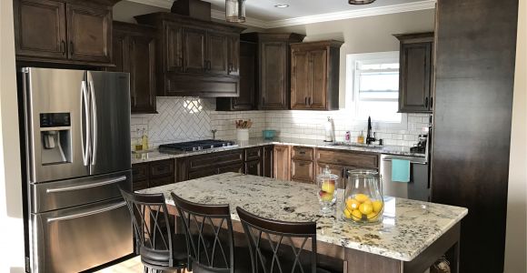 Alaska White Granite with Brown Cabinets Dark Walnut Stained Cabinets Alaska White Granite White Subway