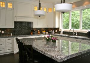 Alaska White Granite with Brown Cabinets Lennon Granite Completed with Gray Subway Tiles and Cupboard Back