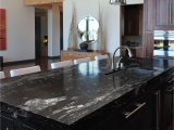 Alaska White Granite with Gray Cabinets Black Beauty Granite Sensa by Cosentino Kitchens Countertops