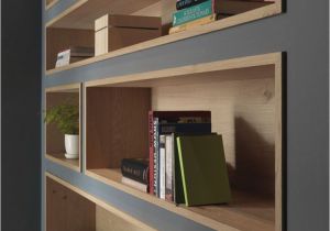 How to Decorate A Half Wall Ledge Built In Bookshelves Lined with Wood Highlight the Displayed Decor