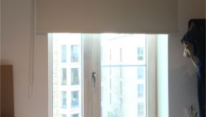 Motorized Blackout Shades with Side Channels Blackout Roller Blind Fitted to French Door to Apartment In Elephant