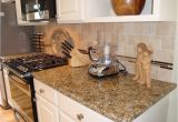 New Venetian Gold Granite with Glass Tile Backsplash New Venetian Gold Granite with Travertine Tile Backsplash