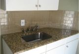 New Venetian Gold Granite with Subway Tile Backsplash Example Of New Venetian Gold Granite In White Kitchen with