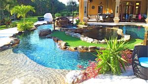 Pools with Blue Surf Pebble Sheen Backyard Oasis Lazy River Pool with island Lagoon and Jacuzzi In the