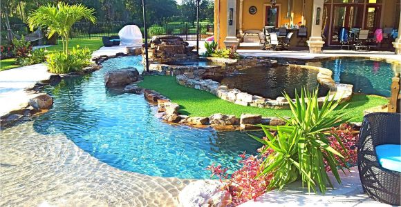 Pools with Blue Surf Pebble Sheen Backyard Oasis Lazy River Pool with island Lagoon and Jacuzzi In the