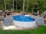 Semi Inground Pools Long island Radiant 18×32 Freeform Built Into A Hill with Stamped Concrete Deck