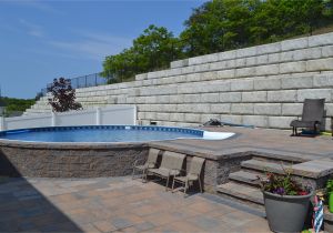 Semi Inground Pools Long island Radiant Semi Inground Round with Pavers Radiant Pools Backyard